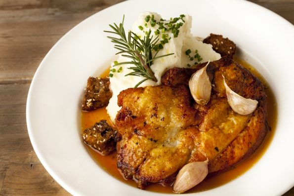 Paul Martin's Brick Chicken, one of the delicious entrees offered at all Paul Martin's American Grills