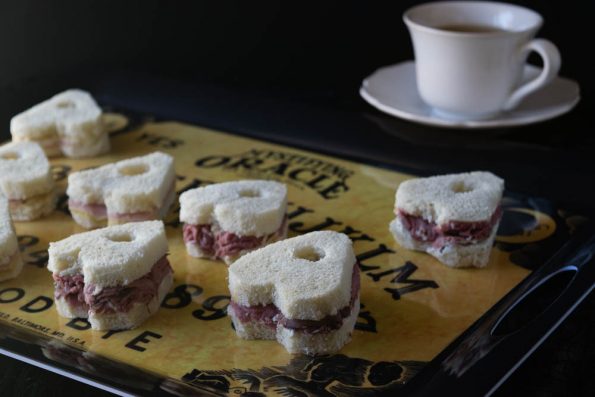 These Ouija inspired tea sandwiches are perfect for a seance or Halloween party. 2geekswhoeat.com #Ouija #Recipe #Halloween