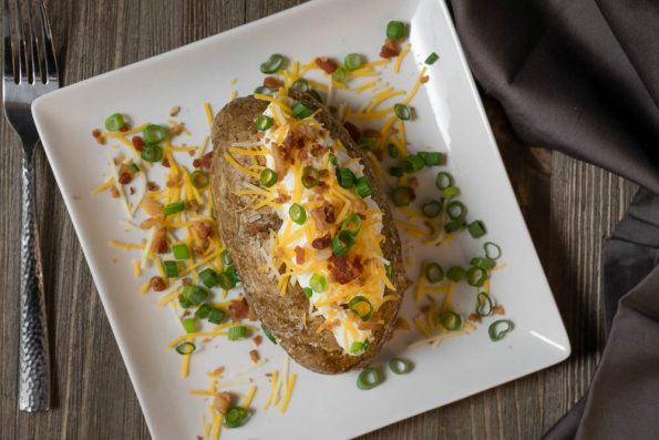 The Geeks share tips and tricks to make the Perfect Baked Potato 2geekswhoeat.com #Potatoes #HowTo