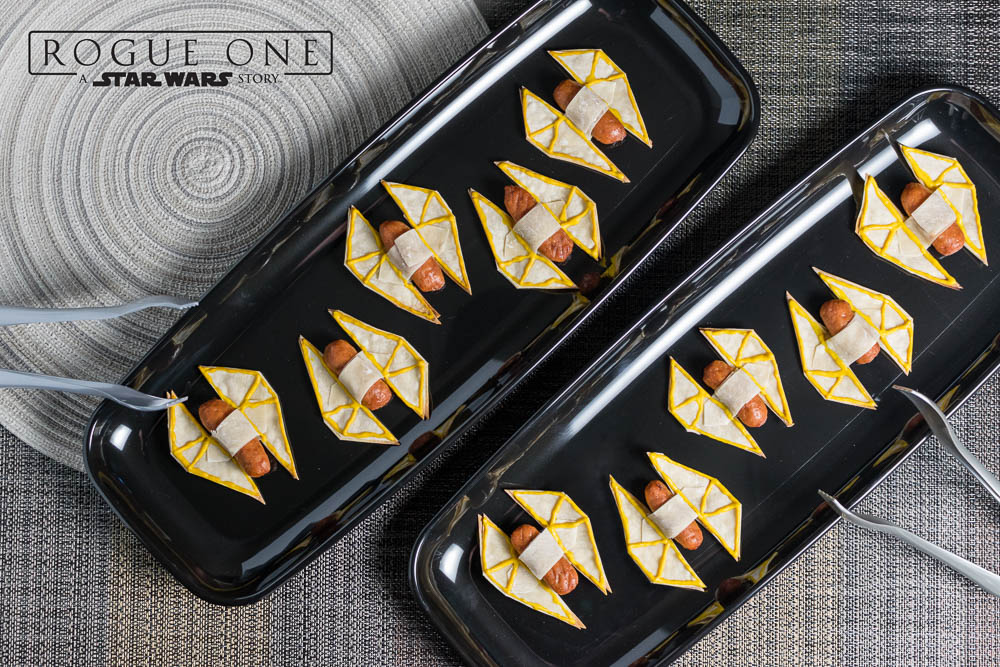 [Sponsored] The Geeks share their 3rd and final Rogue One: A Star Wars Story inspired recipe. They've gone all out with their TIE Striker Appetizers. 2geekswhoeat.com #StarWarsRecipes #StarWars #Appetizers #GeekyRecipes #GeekyFood #StarWarsParty #PartyIdeas