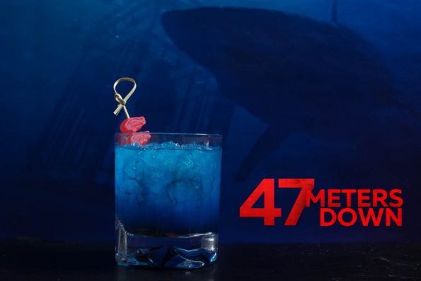 Inspired by 47 Meters Down, The Sinking Feeling is a delicious update to the classic Shark Bite Cocktail [Sponsored] 2geekswhoeat.com #Cocktails #HorrorMovies #Halloween #Horror Recipes #SharkWeek #SharkWeekIdeas