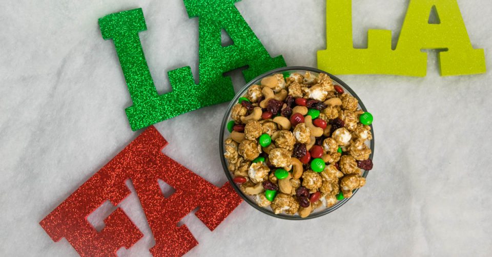 The Geeks share their recipe for a Super Easy Holiday Popcorn Snack Mix, perfect for all of your holiday entertaining needs. 2geekswhoeat.com #recipe #holiday