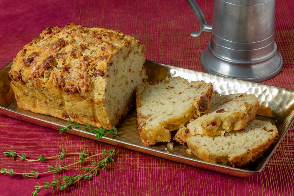 The Geeks have created a Gryffindor themed recipe, Godric's Bacon Cheddar Ale Bread, to celebrate the anniversary of Harry Potter & the Philosopher's Stone. 2geekswhoeat.com #HarryPotter #HarryPotterRecipes #GryffindorRecipes #Baking #BreadRecipes #BeerBread