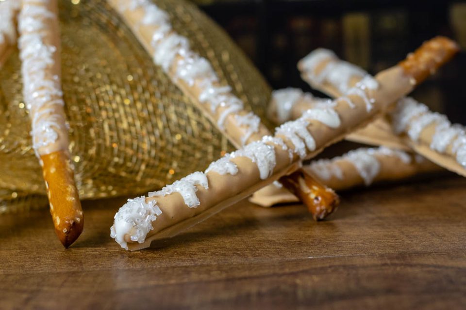 Butterbeer | Harry Potter | Harry Potter Recipes | To celebrate Harry Potter's birthday The Geeks have created a recipe for Butterbeer Pretzel Wands! Not only are they visually appealing but they are delicious as well! 2geekswhoeat.com