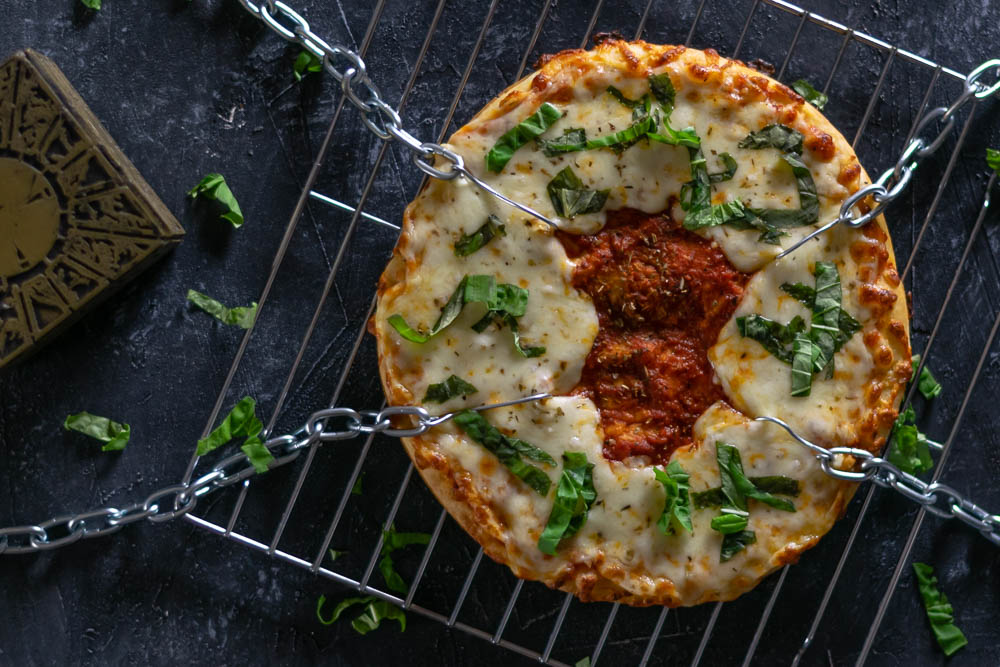 The Geeks have such bites to show you! They've created a recipe perfect for movie night, Pinhead's Pizza, inspired by Clive Barker's Hellraiser. 2geekswhoeat.com  #Hellraiser #Pizza #HorrorMovieFood #HorrorFood #HorrorRecipes #MovieNight #PizzaRecipes