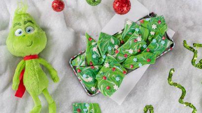 Perfect for a holiday treat or even gift, The Geeks have created a recipe for Grinch-mas Bark inspired by Dr. Suess' The Grinch. 2geekswhoeat.com #TheGrinch #GrinchRecipes #ChristmasRecipes #CandyRecipes
