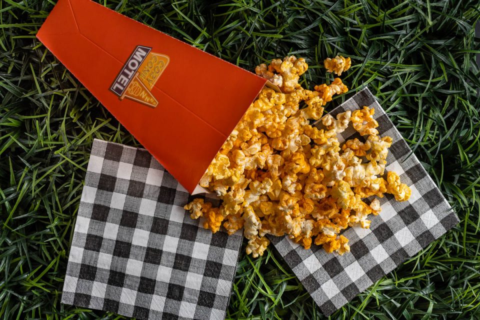 Missing the treats of Cars Land, The Geeks have come up with a copycat recipe for Cozy Cone Buffalo Ranch Popcorn! It will transport you to Cars Land! 2geekswhoeat.com #Disney #DisneyFood #DisneyRecipes #DisneySnacks #DisneyEats #Popcorn #BuffaloRanchPopcorn #GameDayRecipes #SuperBowlFood