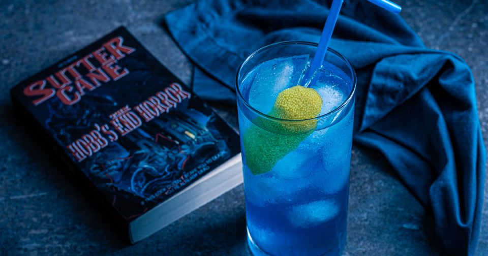 Inspired by John Carpenter's In The Mouth of Madness, The Geeks have created a cocktail perfect for any Sutter Cane fan, the Hobb's End Highball! 2geekswhoeat.com #Cocktails #HomeBartender #HorrorMovieRecipes #HalloweenIdeas #HalloweenParty #MovieNight