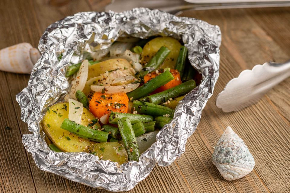 Inspired by the new SpongeBob show, Kamp Koral: SpongeBob's Under Years, The Geeks have put together a recipe for veggie foil packs perfect for summer grilling. 2geekswhoeat.com #Sponsored #Grilling #SummerRecipes #SpongeBobRecipes #GeekyRecipes #GeekyFood